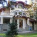 Проект двухэтажного дома с цокольным этажом в стиле модернизма с сауной и двухместным гаражом