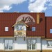 Проект узкого двухэтажного дома с одноместным гаражом и камином