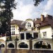 Проект углового трёхэтажного дома из кирпича в стиле барокко с мансардным этажом и двухместным гаражом, с площадью до 600 кв м